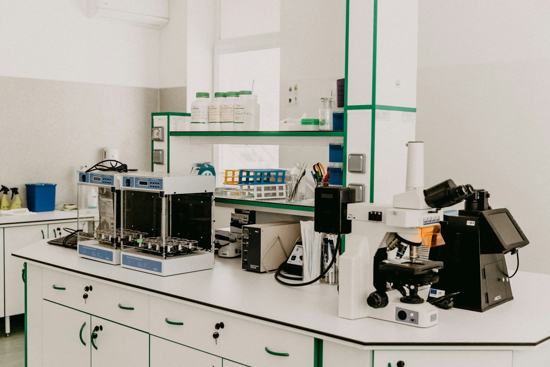 A clinical laboratory bench with a microscope and instruments